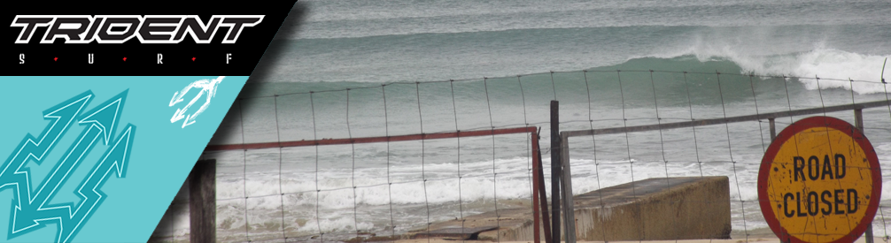 Closed beach sign on gate.